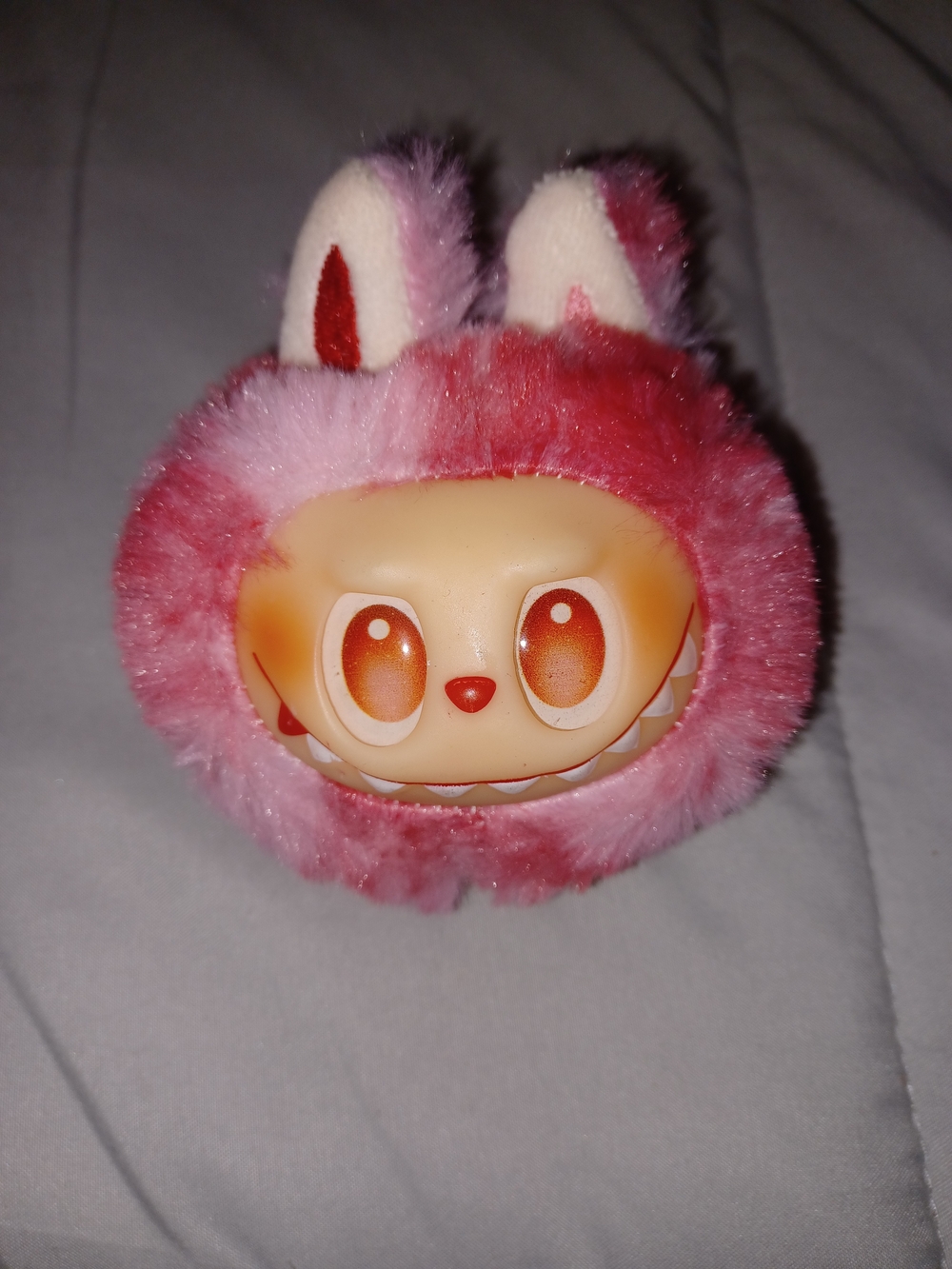pink plush Labubu keychain from Pop Mart's The Monsters collection